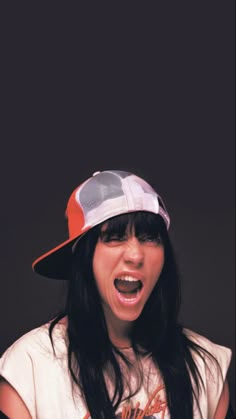 a woman with her mouth open wearing a hat