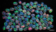 many opalite stones are shown in this image, and there is also a black background