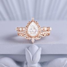 a close up of a ring with a diamond on the center and side stones in the middle