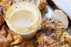 grilled chicken with dipping sauce on top