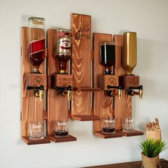 a wall mounted wine rack with several bottles and glasses