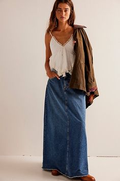 Forever cool and classic denim maxi from our We The Free collection. **Fit:** Mid-rise, A-line silhouette and rigid denim **Features:** Zip fly and button closure, four-pocket design, inverted yoke seam at front, raw-edge hem **Why We | We The Free Come As You Are Denim Maxi Skirt at Free People in Dark Wash, Size: US 6 Long Denim Skirt Outfit, Maxi Jean Skirt, Jean Skirt Outfits, Long Jean Skirt, Denim Skirt Outfits, Long Skirt Outfits, Long Denim Skirt, Maxi Skirt Outfits, Trendy Denim