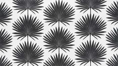 a black and white wallpaper with palm leaves on the backgrounge pattern