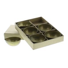 an open box with six brown bowls in it and one empty bowl on the side