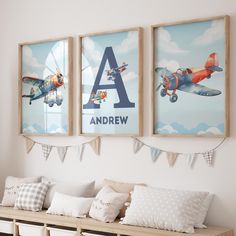 two framed pictures hang on the wall above a bench in a child's room