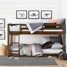 the bunk bed is made up with two sets of mattresses and pillows on it