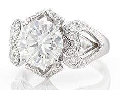 Moissanite Fire(R) 4.00ctw diamond equivalent weight round brilliant, Platineve(R) heart ring. Measures approximately 9/16" L x 1/16" W and is not sellable. Actual moissanite weight is 3.38ctw. Heart-shaped Moissanite Jewelry In Diamond White, Heart-shaped Moissanite Jewelry With Diamond Accents, Round Brilliant, Gemstone Colors, Timeless Beauty, Heart Ring, Gems, Gemstones