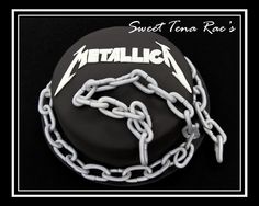 a black and white cake with chains around it that says metallic on the side,