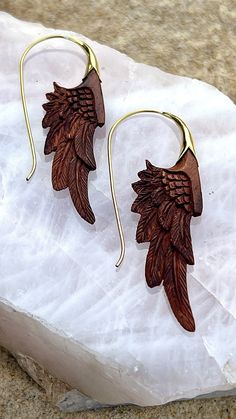 Our exquisite handcarved redwood & brass wing earrings❤️ a stunning accessory that combines natural beauty with intricate design. Crafted from high-quality redwood and brass materials, these earrings feature delicately carved wing shapes that mimic the grace and elegance of a bird in flight. The smooth, polished surface of the redwood perfectly complements the warm, golden tones of the brass, creating a striking contrast that is sure to catch the eye. At approximately 2 inches in length, these earrings are the perfect size to make a statement without overwhelming your look. The lightweight design ensures that they are comfortable to wear all day long, whether you're dressing up for a special occasion or adding a touch of glamour to your everyday style. Each pair of earrings is meticulously Wing Shapes, Bird In Flight, Brass Hoop Earrings, Feather Jewelry, Spiral Earrings, Wing Earrings, Wedding Jewelry Earrings, The Grace, Wood Earrings