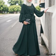 Olivia Mark - Elegant Solid Color Long-Sleeve Maxi Dress with Ruffled Hem Green Chiffon Long Sleeve Maxi Dress, Billowy Long Sleeve Chiffon Maxi Dress, Billowy Chiffon Maxi Dress With Long Sleeves, Billowy Long Sleeve Casual Maxi Dress, Green Chiffon Maxi Dress For Fall, Green Billowy Casual Dress, Modest Green Dress With Ruffles, Modest Green Ruffle Dress, Solid Color Long Sleeve Maxi Dress With Ruffle Hem