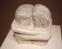 a white sculpture sitting on top of a table