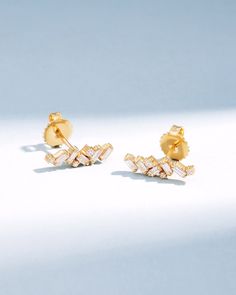 Crafted with 18-karat gold, these elegant baguette diamond studs bring a touch of sophistication to any ensemble. Perfect as a stylish update to your jewelry collection or as a meaningful gift. Details 18k yellow gold, rose gold or white gold 0.60 carats of baguette and round white diamonds 15x5mm dimensions Ref: BAE555 Classic Gold Diamond Earrings With Baguette Diamonds, Classic Gold Diamond Earrings With Baguettes, Gold Baguette Cut Diamond Earrings, Gold Baguette Cut Diamond Earrings With Accents, Classic Gold Baguette Diamond Earrings, Gold Baguette-cut Diamond Earrings, Timeless Gold Diamond Earrings With Baguette Diamonds, Gold Baguette Diamond Earrings For Anniversary, Elegant Gold Diamond Earrings With Baguette Diamonds