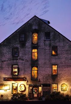 an old building with many windows lit up at night