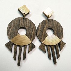 Make a bold statement with these Afro-inspired Tribal Earrings, carefully laser-cut from thin beech plywood and featuring intricate geometric designs. Each pair is handcrafted and showcases digital prints designed by me, layered with double acrylic sheets for a unique texture and vibrant look. These earrings are lightweight, measuring 50 mm to 70 mm in height, making them the perfect large statement earrings that won't weigh you down. Slight variations in color and wood texture add to their uniqueness, as each piece is one-of-a-kind. Perfect for beach days, summer parties, or adding a bold, tribal touch to any outfit, these wooden dangle earrings are sure to be the centerpiece of your jewelry collection. They also make a fantastic gift for anyone who loves unique, handcrafted accessories. Big Statement Earrings, Large Statement Earrings, Earrings Geometric, Handcrafted Accessories, Acrylic Sheets, Wooden Earrings, Wood Texture, Geometric Designs, Fantastic Gifts