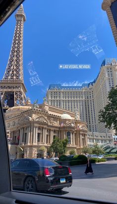 the eiffel tower seen through a car window