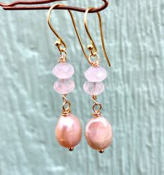 Handmade rose quartz and pink baroque pearl dangle earrings. Baroque Pearl Earrings /Bridal Jewelry /Bridesmaids Gift/ Christmas gift. These earrings features genuine 8-9mm pink baroque fresh water pearls with 4-6mm rose quartz faceted beads in silver, gold, or rose gold options. Simple yet elegant especially the shine and color are so gorgeous.The picture does not do it justice it and is much prettier in person. Draw in romance with this simple yet elegant, soft, dainty design adds a subtle bea Feminine Pink Pearl Drop Earrings, Pink Feminine Dangle Pearl Earrings, Pink Pearl Drop Dangle Earrings, Pink Dangle Pearl Earrings With Ear Wire, Pink Pearl Earrings With Round Ear Wire, Pink Round Pearl Earrings With Ear Wire, Pink Dangle Pearl Earrings, Feminine Pink Jewelry With Pearl Drop, Feminine Pink Pearl Drop Jewelry