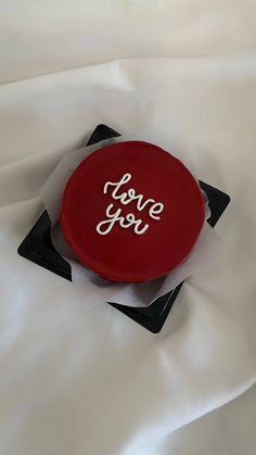 a red frisbee that says i love you on it