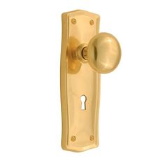 a golden door handle with a keyhole