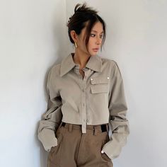 Retro Workwear Short Navel-Baring Shirt Loose Jacket Khaki Single Breasted Utility Jacket With Long Sleeves, Khaki Single-breasted Utility Jacket With Long Sleeves, Khaki Single Breasted Utility Jacket, Khaki Single-breasted Long Sleeve Utility Jacket, Khaki Single-breasted Utility Jacket, Khaki Collared Outerwear, Khaki Long Sleeve Shirt With Flap Pockets, Khaki Tops With Lapel Collar And Pockets, Fitted Khaki Utility Jacket With Long Sleeves