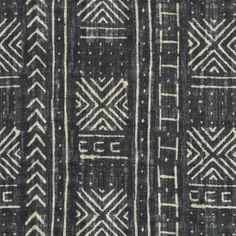 an old black and white rug with geometric designs