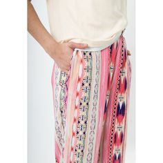 Experience the perfect blend of style and comfort with our hip and fun rayon lounge pants. Crafted with soft and drapey fabric, these pants offer a roomy fit that ensures maximum comfort throughout the day. The iconic ivory and pink ikat print adds an artistic touch, making a bold statement wherever you go. Whether you're lounging by the pool or running errands, these pants are perfect for both relaxed and fashionable occasions. The wide-leg silhouette offers a flattering look that exudes a fres Multicolor Wide-leg Bottoms With Elastic Waistband, Multicolor Wide-leg Pants With Elastic Waistband, Loungewear Harem Pants With Elastic Waistband, Multicolor Ankle-length Wide Leg Pants With Elastic Waistband, Bohemian Lounge Pants With Elastic Waistband, Summer Loungewear Harem Pants With Tapered Leg, Summer Loungewear Tapered Leg Harem Pants, Trendy Ankle-length Harem Pants For Loungewear, Summer Tapered Leg Harem Pants For Loungewear