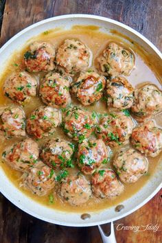 meatballs with gravy in a white bowl on a wooden table and text overlay that reads tender, succulent turkey meatballs