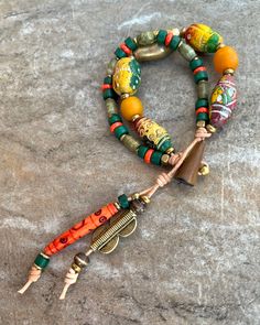 Colorful Tribal Boho Bracelet African Clay, Brass, Carved Bone and Glass Dual-tone Brass Bohemian Jewelry, Colorful Multi-strand Bohemian Beads, African Brass Jewelry, African Recycled Glass Bead Bracelets, Bohemian Chic Jewelry, African Brass Beads, Terracotta Clay, Carved Bone, Boho Bracelet