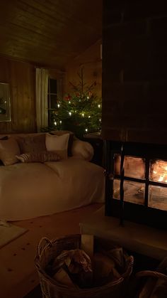 a living room filled with furniture and a fire place in the middle of it's fireplace