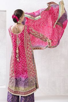 Chunri Silk Salwar Kameez Pakistani Wedding Dresses is a heavily embellished chunri shirt combining intricate zardozi, block print, and gotta work is the perfect addition to your wedding-wear wardrobe. It is Paired with cotton net trousers featuring exquisite gotta work. Tri-colored chunri dupatta with block printed borders accentuated with thread embroidery and gotta work. Embroidered Kameez: This designer Pakistani wedding dress comes in an alluring naqshi, dabka, and sequin embellishments, th Chunri Design Dress, Chunri Print Kurti Designs, Chunri Suit Design, Chunari Dress, Gotta Work Dresses Pakistani, Chunri Dress Design, Chunri Dresses, Chunri Dress, Chunri Design