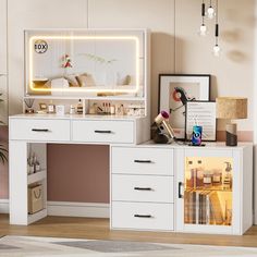 a white desk topped with lots of drawers under a mirror and lights above the top