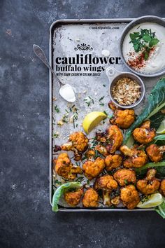 cauliflower and other foods are on a tray