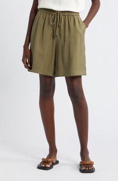 Slip into the casual ease of loose-fitting shorts topped with a comfortably customizable drawstring waist. Elastic/drawstring waist 91% viscose, 9% polyester Machine wash, line dry Imported Summer Nylon Drawstring Shorts, High-waisted Relaxed Fit Pajama Shorts With Drawstring, Green Pajama Shorts With Elastic Waistband, Relaxed Fit, Khaki Short-length Bottoms With Drawstring, Outdoor Shorts With Functional Drawstring And 4-way Stretch, Drawstring Waist Shorts, Drawstring Waist, Short Tops, Womens Bottoms