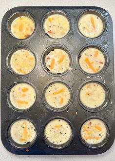 a muffin tin filled with cupcakes covered in cheese