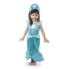 This stunning mermaid costume features a shimmering dress with a tail that flares into a fishtail! Glittering fabrics, silvery accents, and a royal seashell tiara make this kids' dress-up set truly special. Crafted with care and durable construction to stand up to years of pretend play! Details Mermaid dress-up outfit and accessories Includes glittering mermaid gown with flared tail, and seashell tiara. High-quality fabrics and construction Ideal for pretend play Hand wash in cold water. Do not Seashell Tiara, Role Play Costume, Play Pretend, Kids Dress Up, Halloween Costume Shop, Toddler Costumes, Kids Party Supplies, Dress Up Outfits, Dress Up Costumes