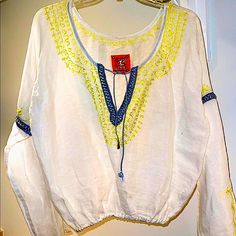 Amazing, Comfortable And Unique This Free People Embroidered With Yellow Treads And Satin Silk Gray Details. Hip Length With And Elastic On The Bottom. Loose And Fresh. Will Fit A Size 4 To An 8. Long Sleeves. Perfect For Every Season. Unique Like All My Other Items. Casual Long Sleeve Top With Contrast Embroidery, Yellow Tops With Chikankari Embroidery For Spring, Yellow Chikankari Embroidery Top For Spring, Long Sleeve Tops With Contrast Embroidery For Spring, Casual Summer Embroidered Top With Chikankari, Casual Chikankari Embroidered Top For Summer, Casual Long Sleeve Tops With Embroidered Border, Casual Embroidered Top With Hem Detail For Vacation, Casual Tops With Embroidered Border For Spring