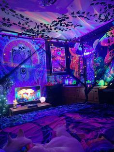 a bedroom decorated in purple and blue lights