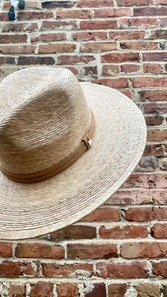 Handmade by artisans in Mexico, our new 100% baked palm leaf Islander Hat is perfect for spring and summer wear. Featuring a molded crown and tightly woven pressed palm, this hat offers the most sun protection. Embellished with a faux suede band and exclusive cut Swarovski crystals. - Hat is one size fits all and the band on the inside is stretchy. If you think you’ll want a tighter fit or have a smaller head, we can attach a foam piece behind the band to reduce the size. - Can be removed. REQUE Artisan Toquilla Straw Hat For Kentucky Derby, Artisan Flat Brim Toquilla Straw Hat, Adjustable Flat Crown Toquilla Straw Hat, Handmade Toquilla Straw Panama Hat With Curved Brim, Artisan Panama Hat With Flat Brim In Toquilla Straw, Artisan Toquilla Straw Panama Hat With Flat Brim, Artisan Flat Brim Straw Hat For Kentucky Derby, Adjustable Natural Color Fedora With Flat Crown, Natural Fedora With Adjustable Flat Crown