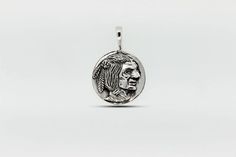 A Native Head Coin Charm pendant with a portrait of a woman by Super Silver. Spiritual Sterling Silver Charm Necklace With Coin Pendant, Silver Amulet Coin Necklace With Large Pendant, Silver Coin-shaped Medallion Necklace, Nickel-free Sterling Silver Medallion Coin Necklace, Silver Coin-shaped Medallion Necklace In Brass, Indian Head, Small Pendant, Pocket Watch, Silver Charms