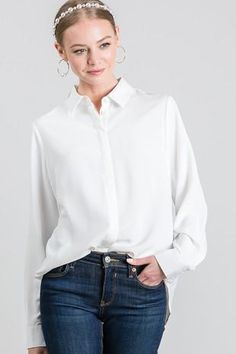 Ivory hidden button dress shirt, boyfriend shirt style, crepe fabric, 100% polyester, hidden button down trim, double button cuffs, can be worn tucked in or untucked. b White Button-up Blouse With Hidden Buttons, White Button-up Blouse With Hidden Closure, White Blouse With Rolled Sleeves For Work, Elegant White Blouse With Shirttail Hem, Elegant Spring Blouse With Button Back, Elegant White Shirt With Shirttail Hem, Elegant Shirt With Rolled Sleeves For Work, Elegant Business Casual Blouse With Rolled Sleeves, Elegant Rolled Sleeves Spring Blouse