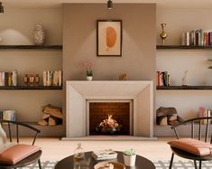 a living room filled with furniture and a fire place in the middle of a room