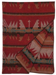 a red and brown blanket with arrows on it