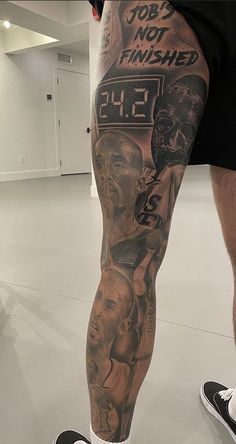 a man's leg with tattoos on it and the words, job not finished