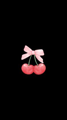 two cherries tied with pink ribbon against a black background in the shape of a bow