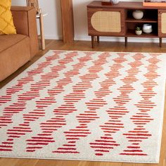 a red and white rug in a living room