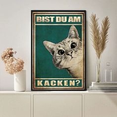 a poster with a cat's face and the words best du am kacken?