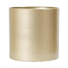 a gold colored candle holder on a white background