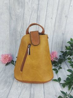 This SMALL beige and brown soft Italian backpack is ideal for when you need a bag that is both practical but also very stylish. This SMALL backpack has been handmade by artisans, and is a perfect bag to for all those essentials such as smartphone, cards, keys and make-up. It is fully lined with an internal zipped pocket for the things you like to keep safe & secure. It also has an additional zipped pocket on the front of the bag. Full product specification/features: * Made from synthetics * Insi Brown Backpack With Adjustable Strap, Brown Softback Backpack For Daily Use, Brown Softback Backpack For On-the-go, Brown Softback Backpack For Travel, Beige Soft Leather Backpack For Everyday Use, Light Brown Backpack For Everyday Use, Beige Soft Leather Satchel Backpack, Beige Leather Softback Backpack For Everyday Use, Everyday Beige Leather Softback Backpack