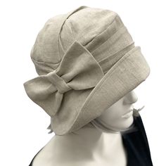 This is the Alice shown here in a pale gray Linen , in true Downton Abbey Style . The ever gorgeous Alice is stylish, elegant and Oh so Comfortable! Alice is styled on the designs from the flapper period. A time in the 1920's and 30's when hats were a MUST.Look the part, whether it be a vintage inspired occasion or one where you want to look and feel polished, finished and have that "wow" factor. Wear your Alice with pride and distinction on your next cruise or even your walk along the beach Mad Flapper Fashion, Downton Abbey Style, 1930s Hats, Bespoke Hats, Dressy Hats, Downton Abbey Fashion, Millinery Hats, Hat Handmade, Flapper Style