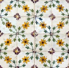 a tile with yellow flowers on it