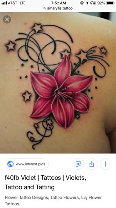 the back of a woman's shoulder with pink flowers and swirls on it